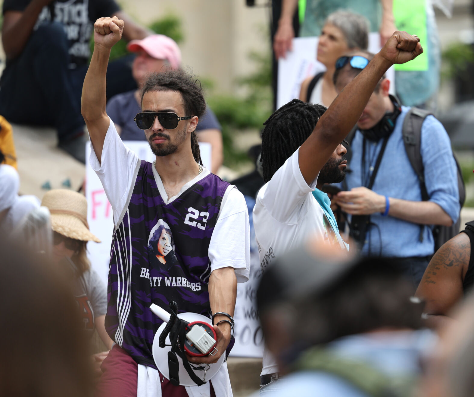 Man holds up fist at Metro Hall.JPG